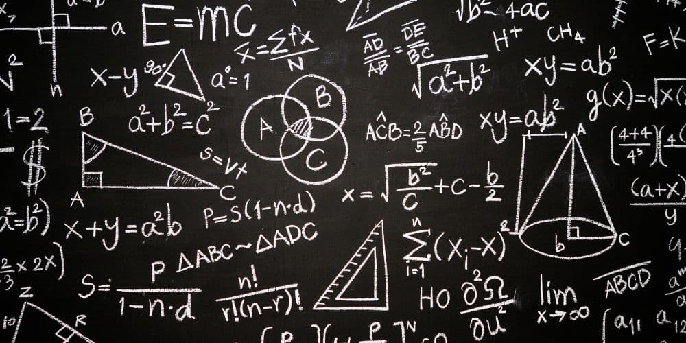 A blackboard with a lot of math equations on it