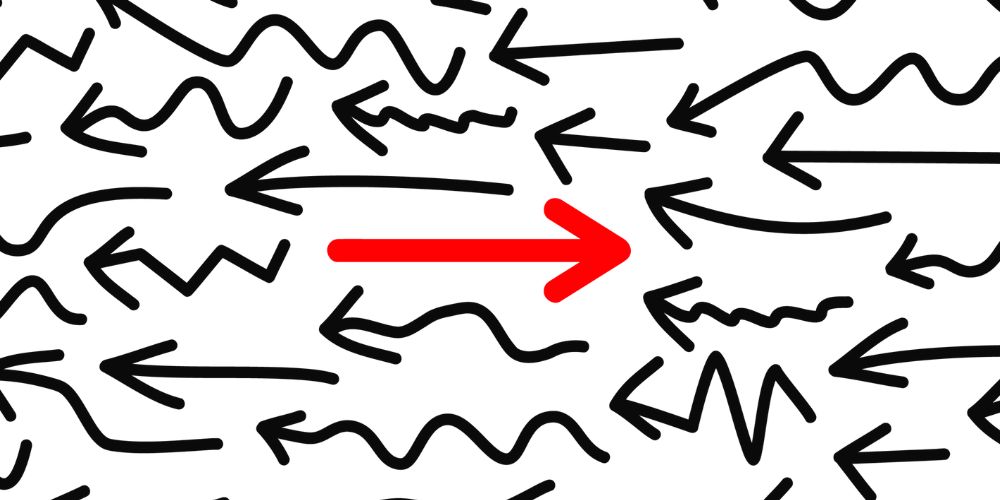 There is a red arrow pointing to the right in the middle of a bunch of black arrows.